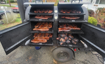 chef carving brisket bbq